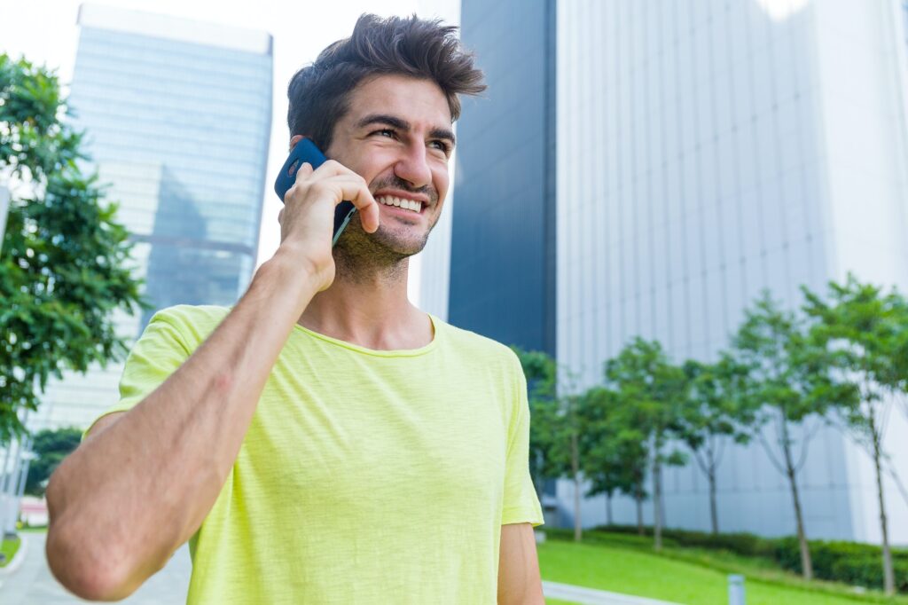 Caucasian man talk to cellphone at outdoor