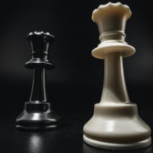 Chess game with chess pieces against black background